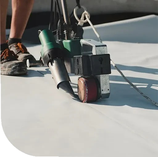 An old tractor on a dirt road. The tractor appears to be vintage.