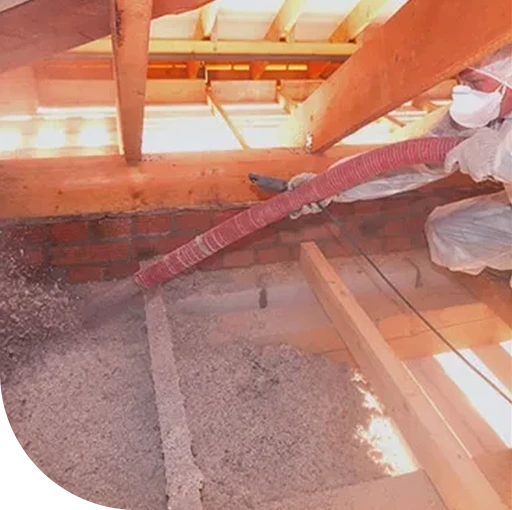 An old, monochrome aerial view of buildings and structures. The image appears to be heavily distressed.