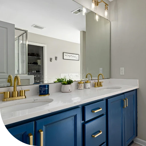 A kitchen with pots on the counter. The room appears to be old.