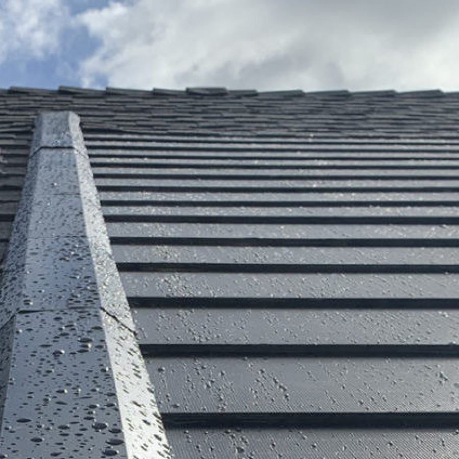 Close-up of a wet roof with rainwater on slats.