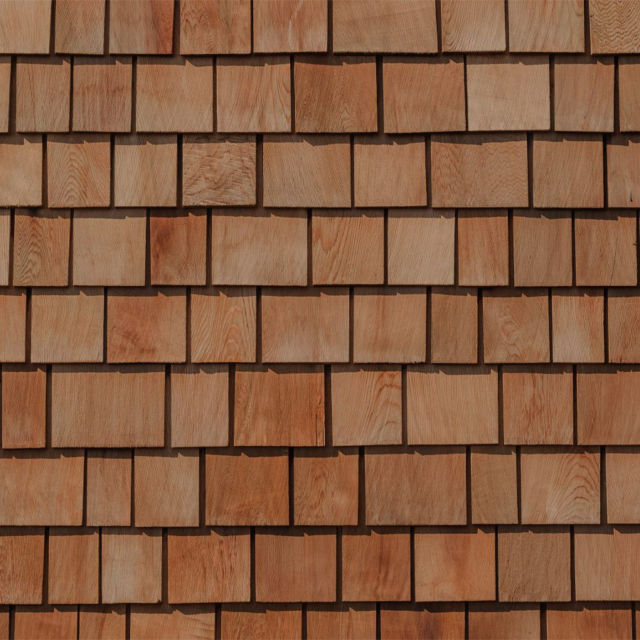 A wall made of small wooden bricks. The bricks are arranged in a staggered pattern.