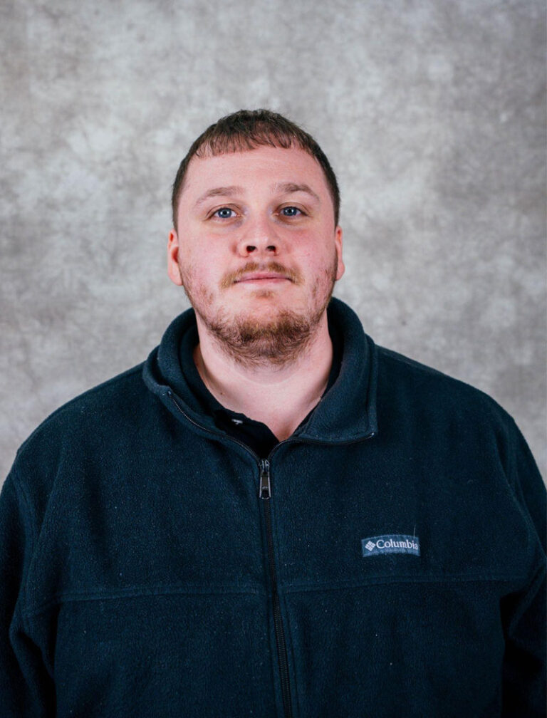 man in dark blue sherpa jacket, portrait